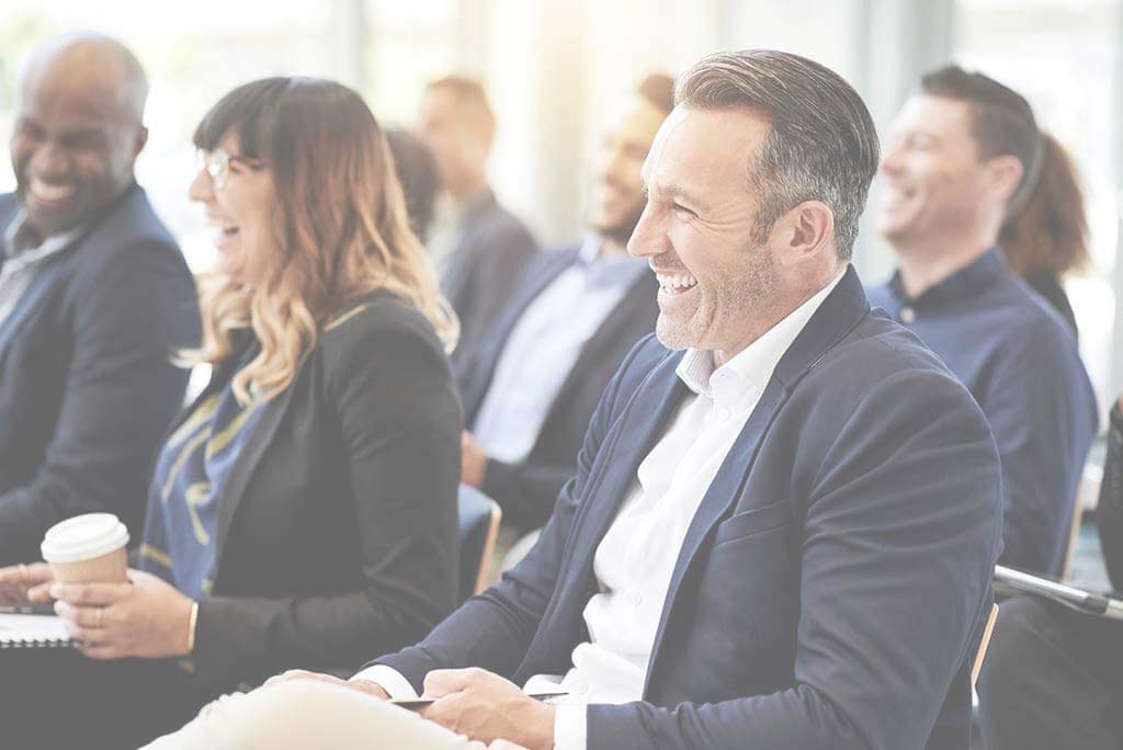 Man with hearing loss at a work event.