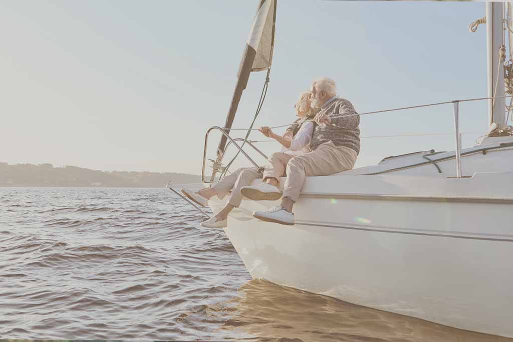 Mature couple sailing.