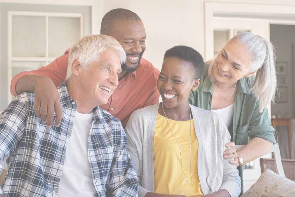 Two middle age couples enjoying a laugh. 